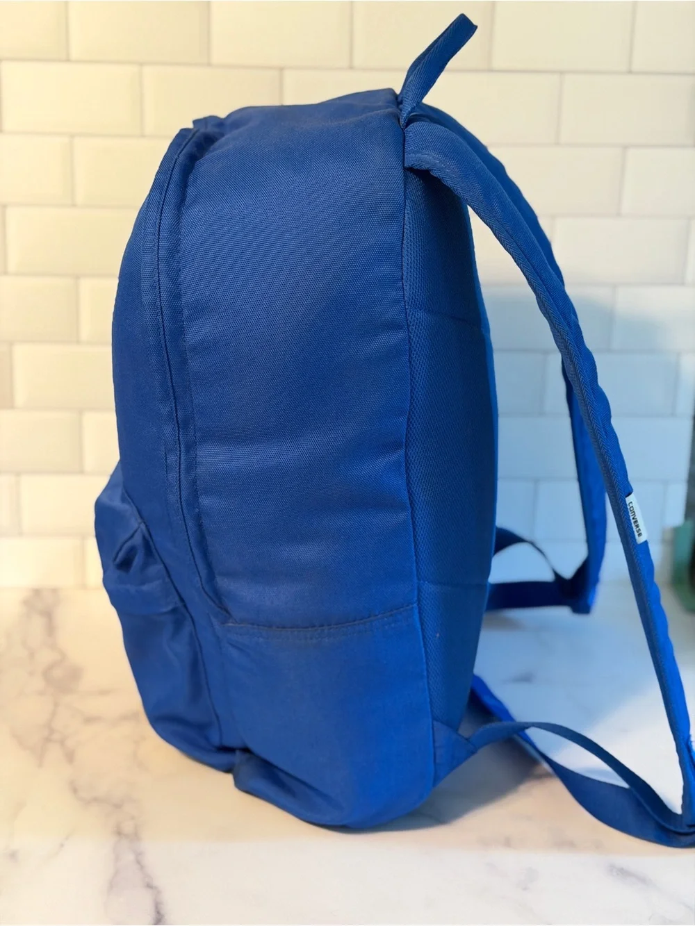 Converse All Star backpack in blue with classic Chuck Taylor logo patch.